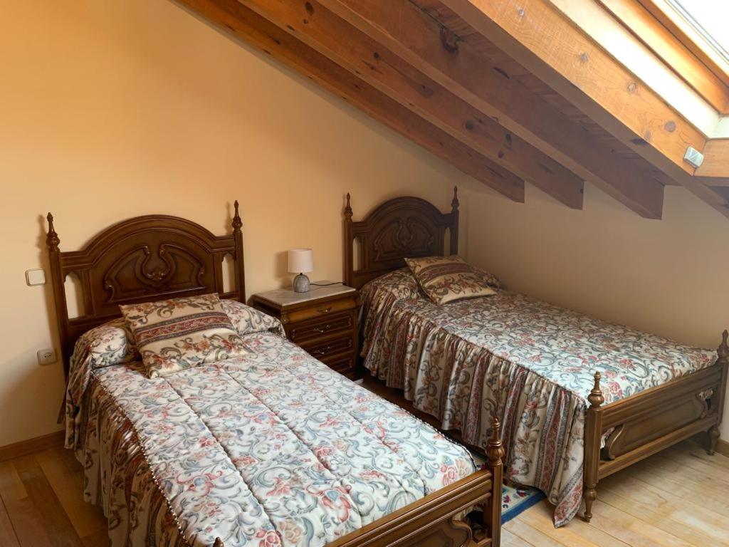 Postel nebo postele na pokoji v ubytování Rincón de Ayllon