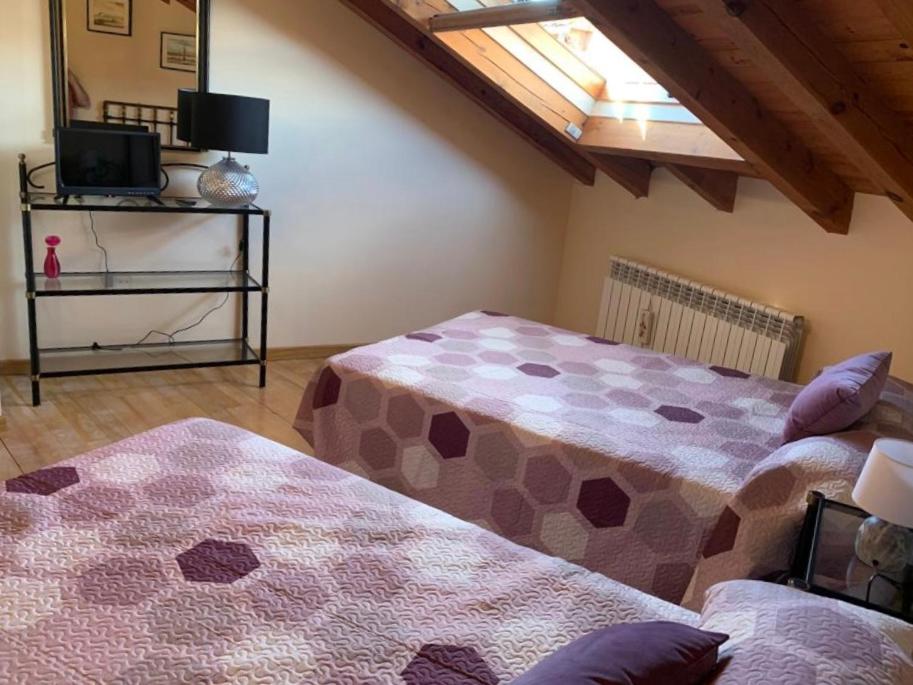 Postel nebo postele na pokoji v ubytování Rincón de Ayllon