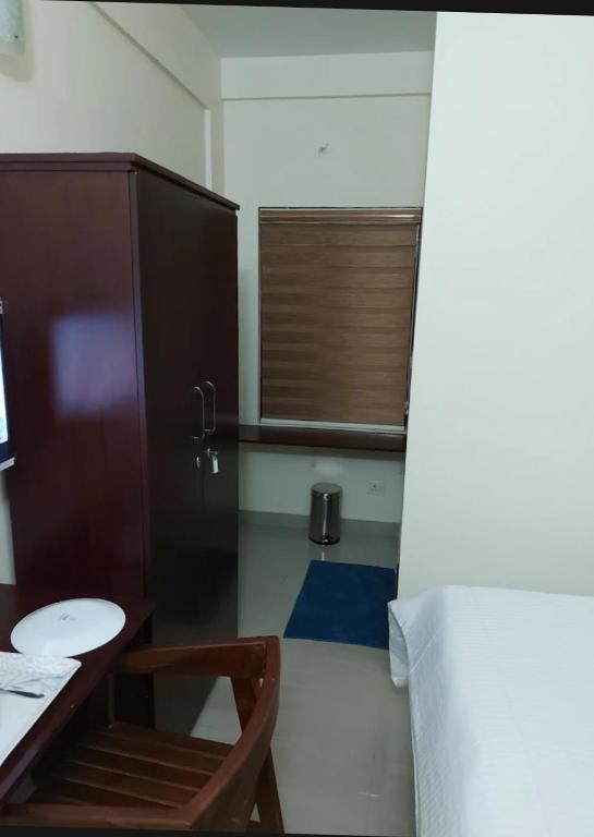 Postel nebo postele na pokoji v ubytování Masterkey Deluxe Rooms