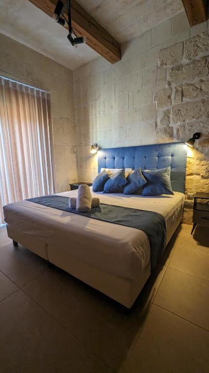 Ein Bett oder Betten in einem Zimmer der Unterkunft Sea Holly Gozo