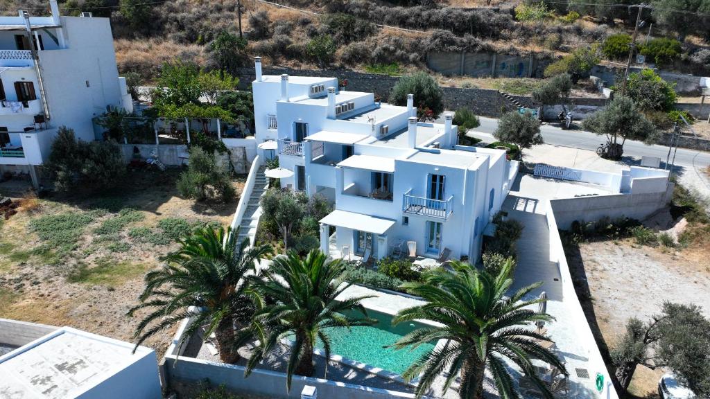 an aerial view of a white house with a swimming pool at Amphitrite Apartments Skyros in Skiros