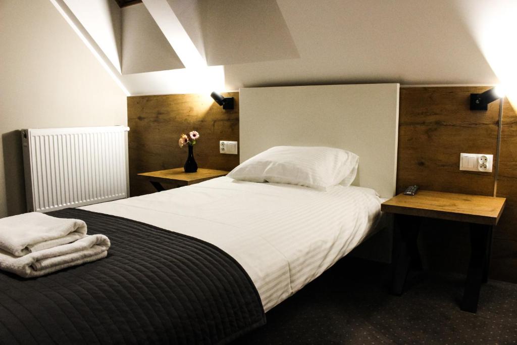 Posteľ alebo postele v izbe v ubytovaní Hotel Regina