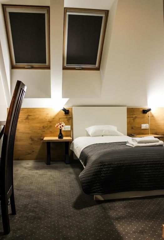 Posteľ alebo postele v izbe v ubytovaní Hotel Regina