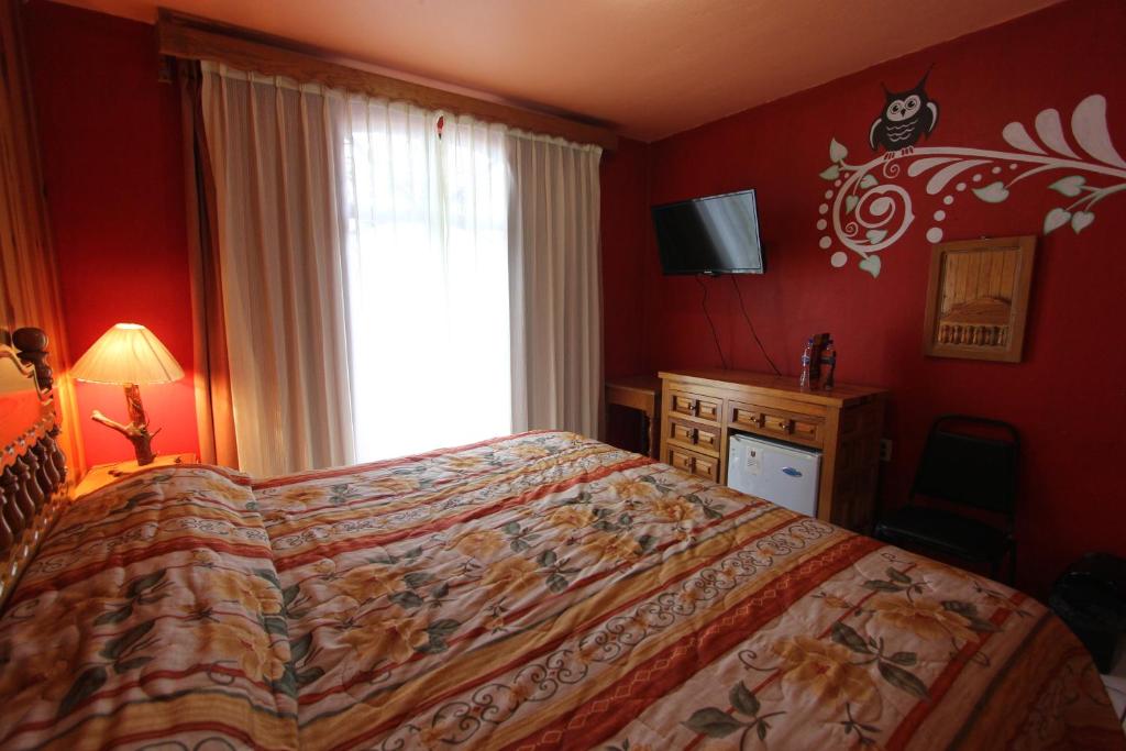 Postel nebo postele na pokoji v ubytování Hotel Real de la Sierra