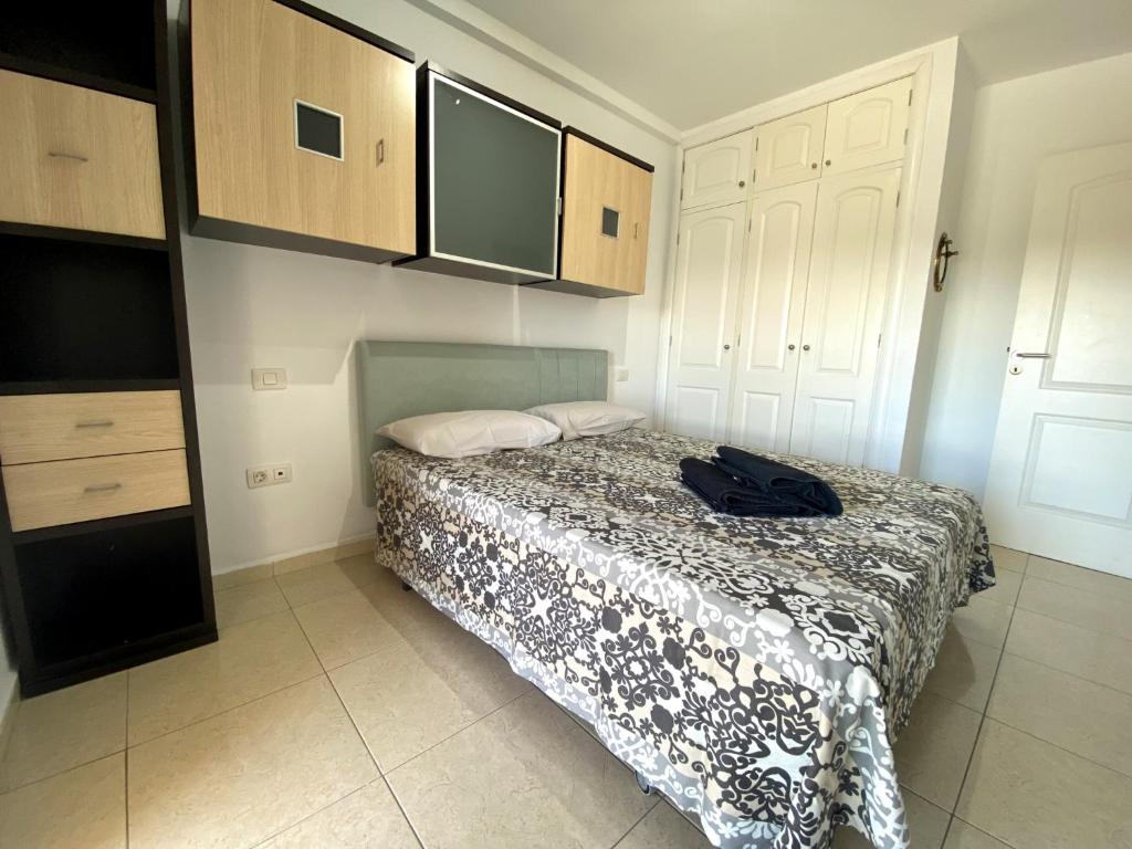 Postel nebo postele na pokoji v ubytování Apartamentos Medano - La Ladera