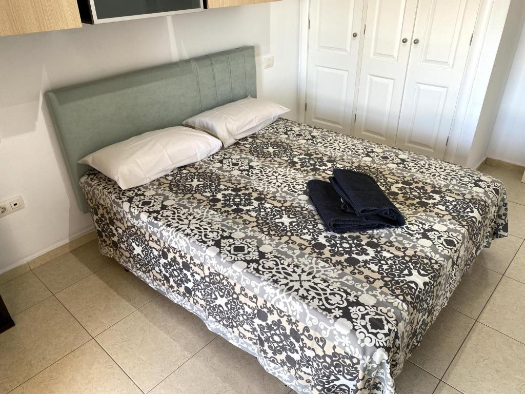 Postel nebo postele na pokoji v ubytování Apartamentos Medano - La Ladera