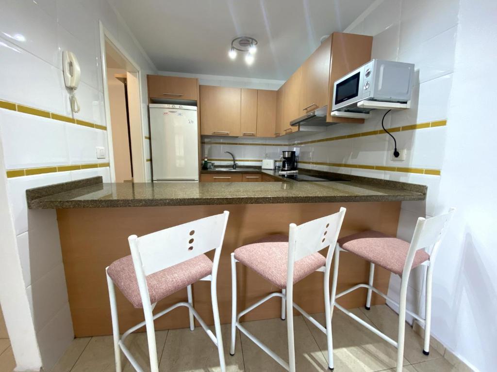 Kuchyň nebo kuchyňský kout v ubytování Apartamentos Medano - La Ladera