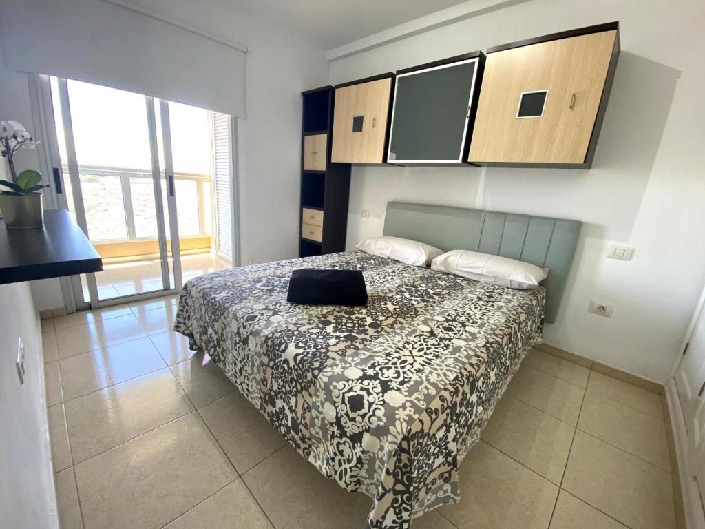 Postel nebo postele na pokoji v ubytování Apartamentos Medano - La Ladera