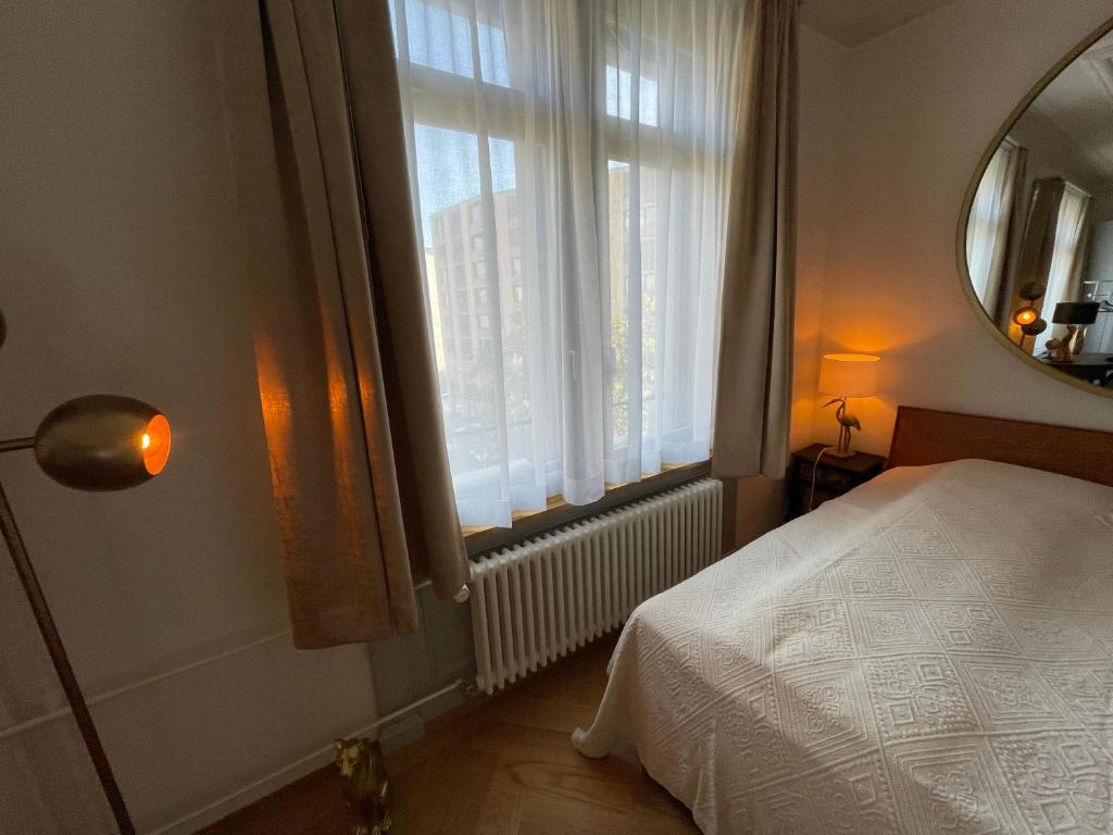 Postel nebo postele na pokoji v ubytování Exclusive one room apartment next to Zürich main station