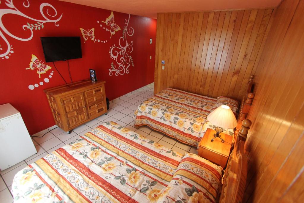 Postel nebo postele na pokoji v ubytování Hotel Real de la Sierra