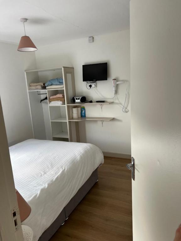 Postel nebo postele na pokoji v ubytování Torine House B&B
