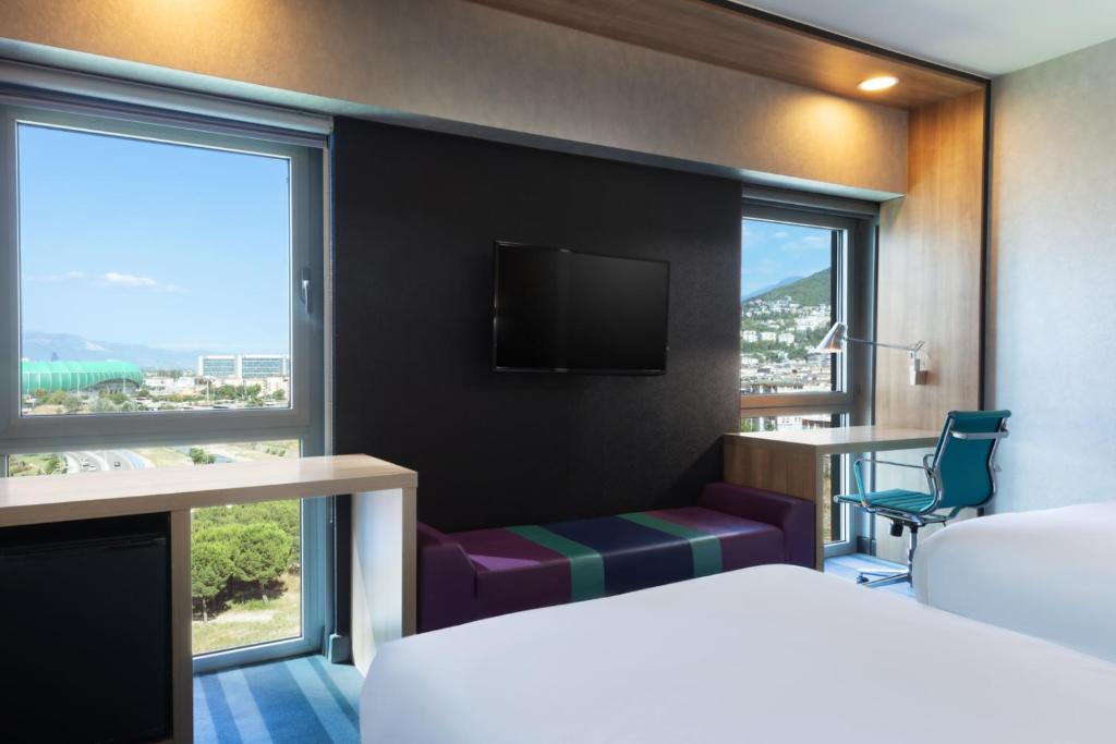 Кровать или кровати в номере Aloft Bursa Hotel