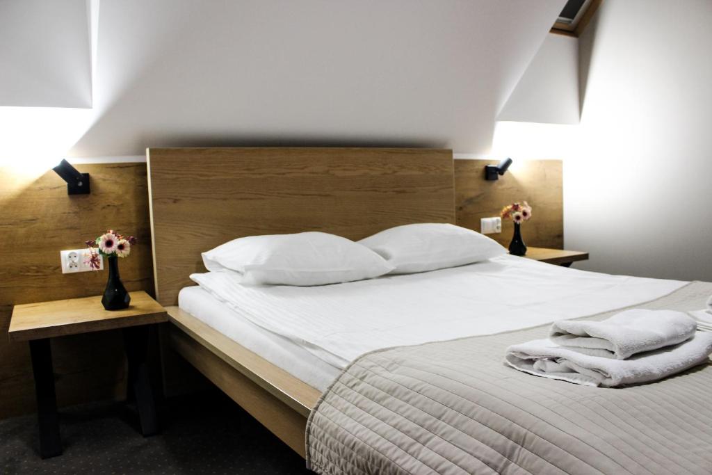 Posteľ alebo postele v izbe v ubytovaní Hotel Regina