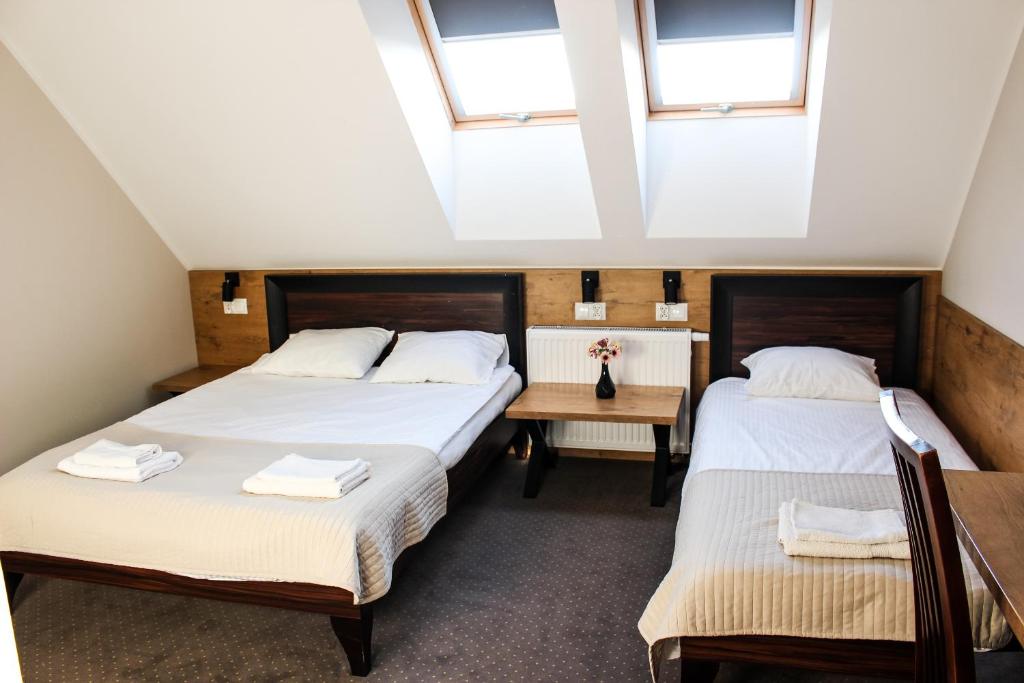 Posteľ alebo postele v izbe v ubytovaní Hotel Regina