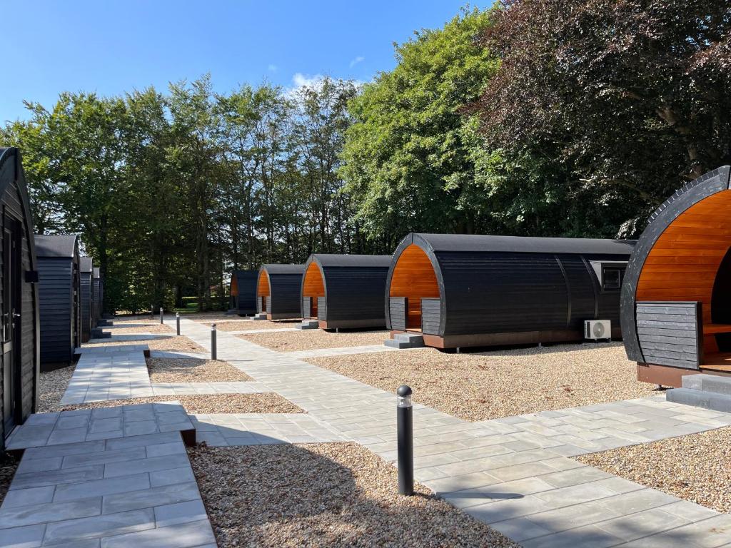 a row of camping huts in a park at Helle Aktivitetshotel in Årre