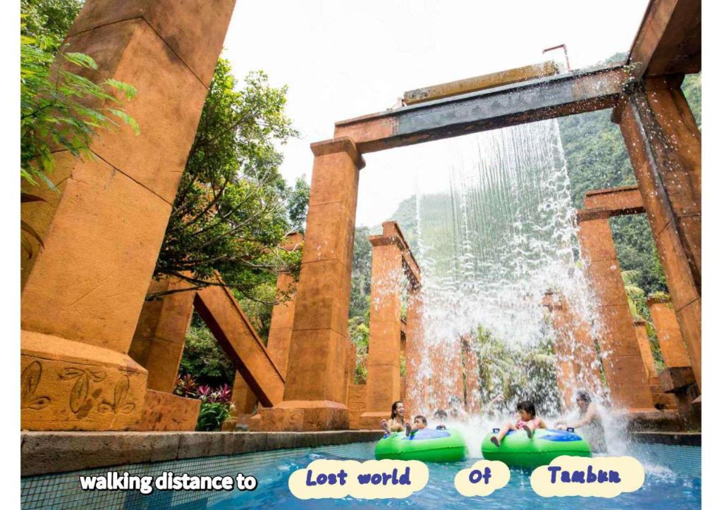 a group of people in a water park at JOMSTAY Sunway Onsen Suites Ipoh - Lost World of Tambun Ipoh Waterpark in Tambun