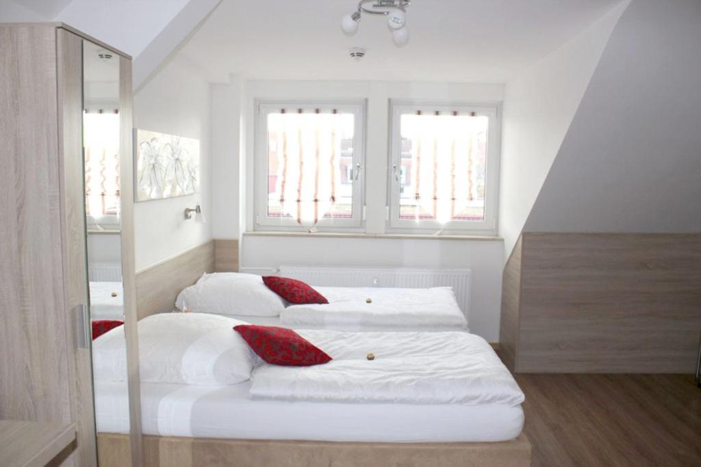Postel nebo postele na pokoji v ubytování Das Falk Apartmenthaus