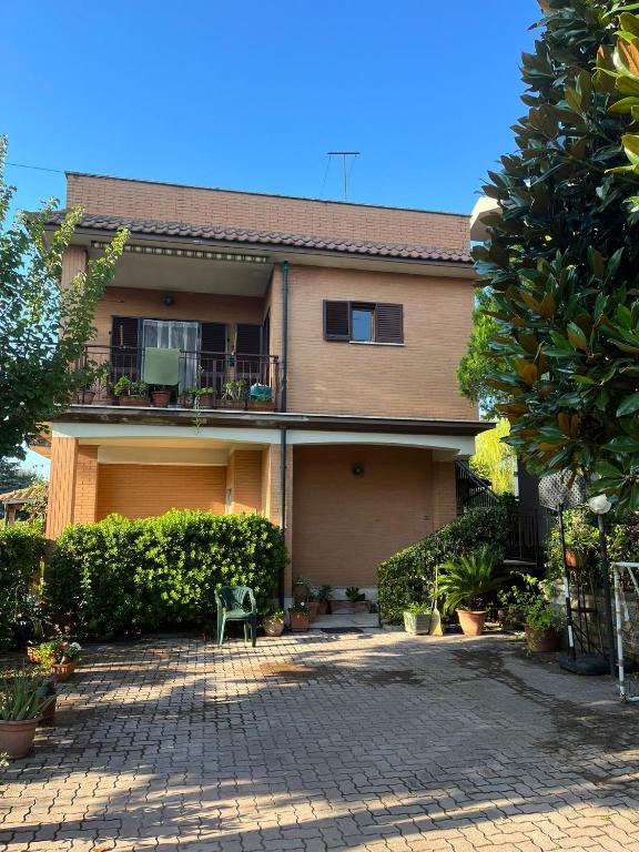 a house with a brick driveway in front of it at A casa dei CHICCHI in Settecamini
