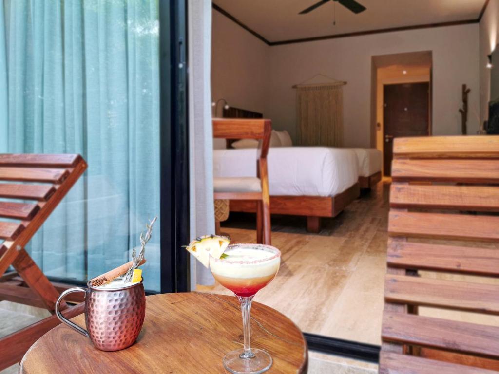 Postel nebo postele na pokoji v ubytování Kimpton Aluna Resort Tulum by IHG