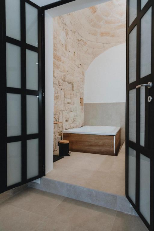 Postel nebo postele na pokoji v ubytování al 22 Suite & Spa Luxury Experience