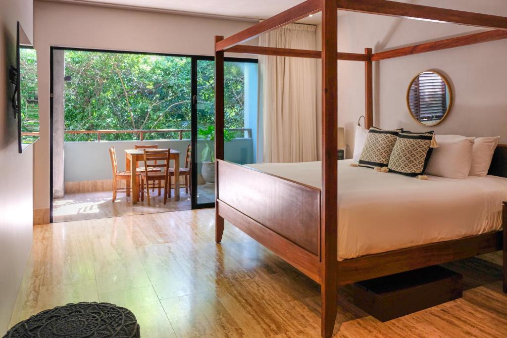 Postel nebo postele na pokoji v ubytování Kimpton Aluna Resort Tulum by IHG