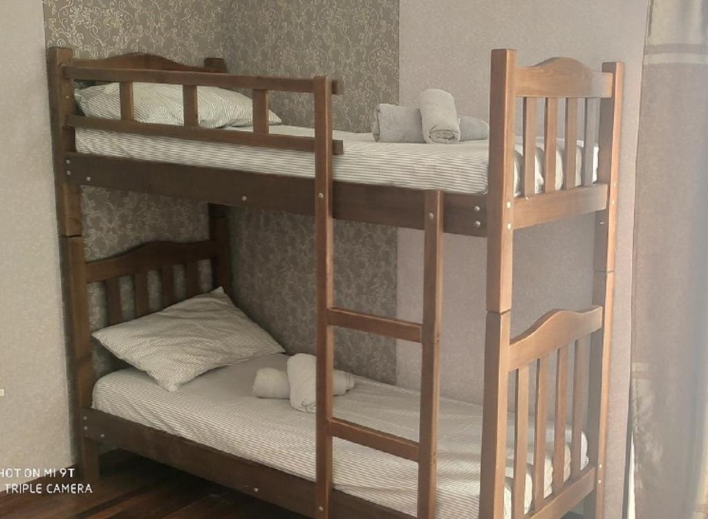 Postel nebo postele na pokoji v ubytování Tirkius House