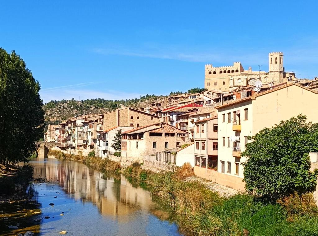 a view of a river in a city with buildings at ATALAYA DEL RÍO in Valderrobres