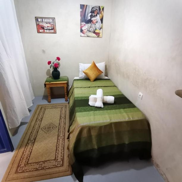 Postel nebo postele na pokoji v ubytování RIAD DAR LFONOUN