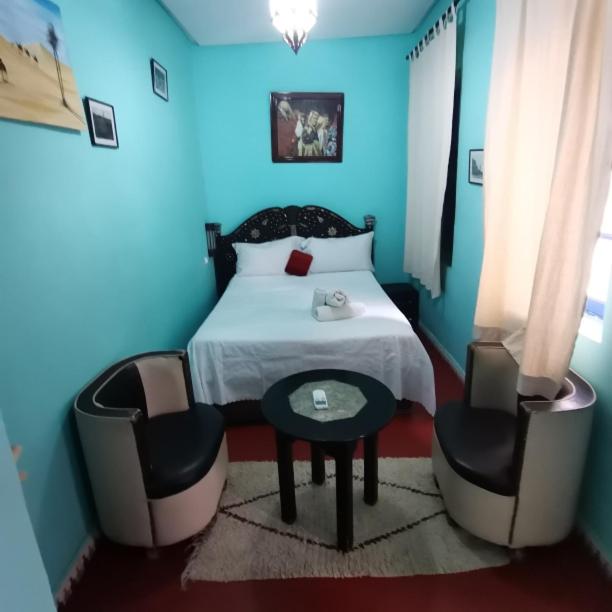 Postel nebo postele na pokoji v ubytování RIAD DAR LFONOUN