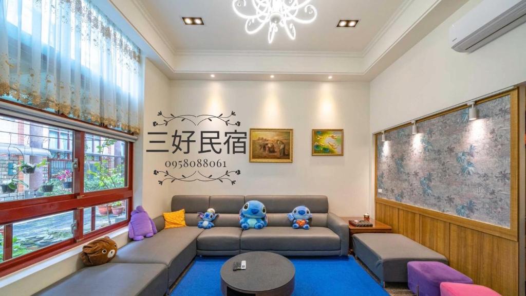 a living room with a couch and a table at 羅東三好Sam-hao Homestay in Luodong