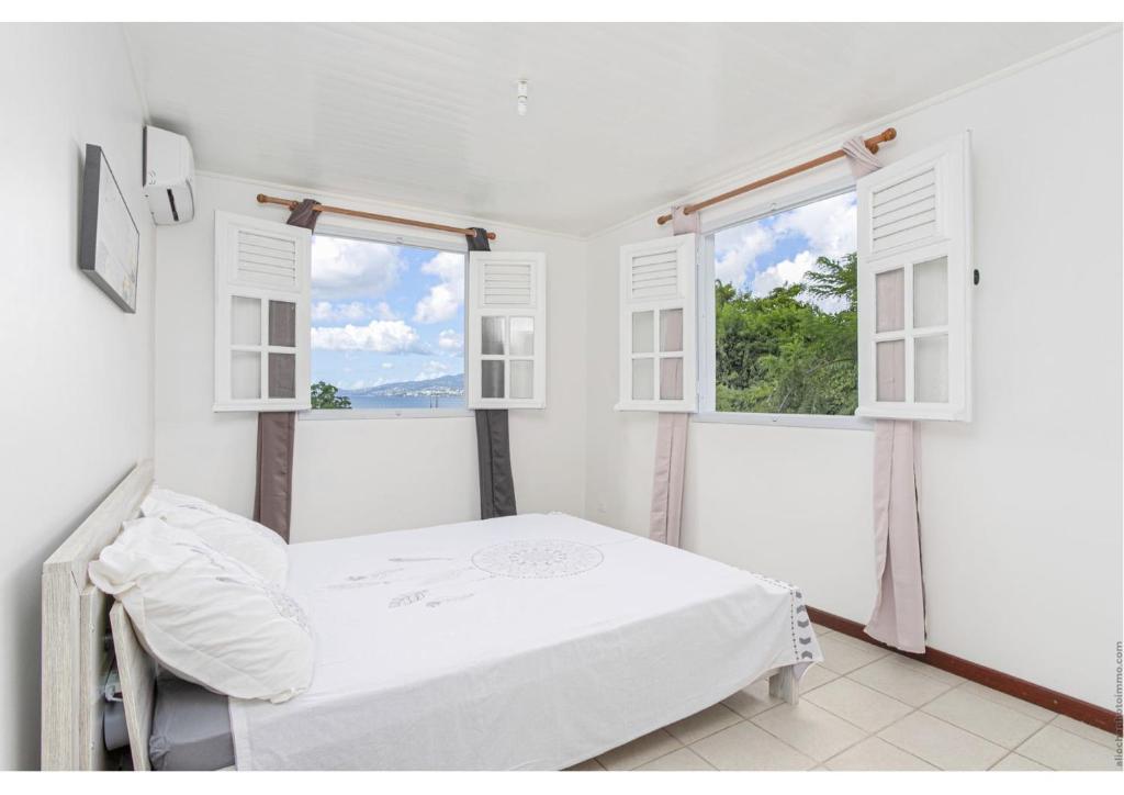 Postel nebo postele na pokoji v ubytování Anthurium, Superbe haut de villa F3 proche plage, Anse Mitan