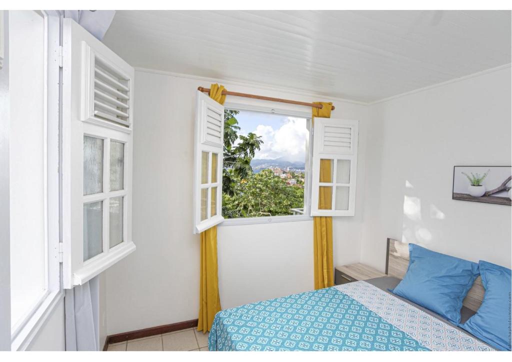 Postel nebo postele na pokoji v ubytování Anthurium, Superbe haut de villa F3 proche plage, Anse Mitan