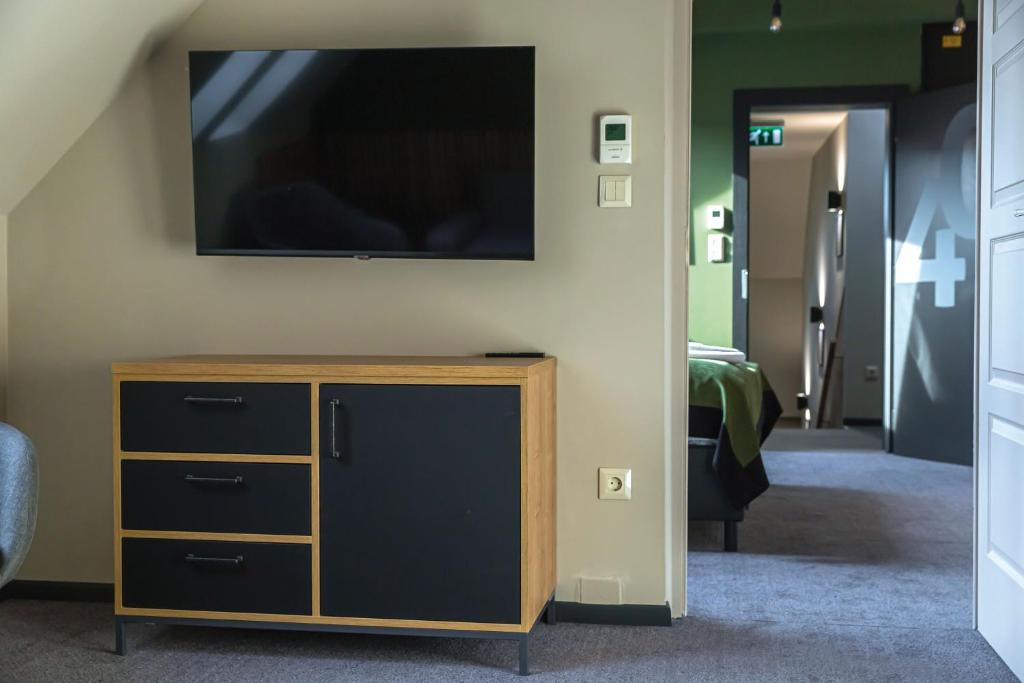 TV a/nebo společenská místnost v ubytování Oliva Hotel