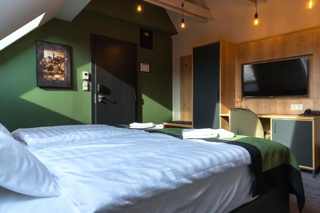 Postel nebo postele na pokoji v ubytování Oliva Hotel