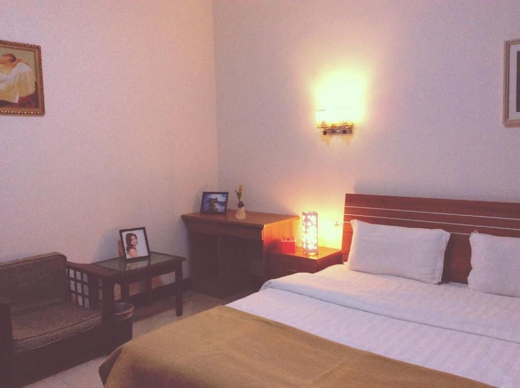 Postel nebo postele na pokoji v ubytování Huashan Gehui Hotel