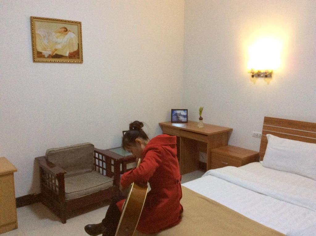 Postel nebo postele na pokoji v ubytování Huashan Gehui Hotel