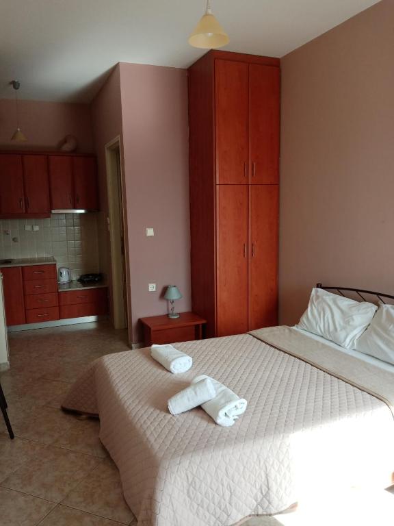 Ένα ή περισσότερα κρεβάτια σε δωμάτιο στο jusmine apartments