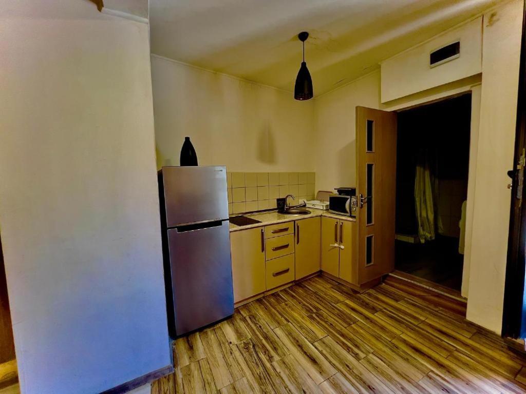 Kuchyň nebo kuchyňský kout v ubytování HotelHarmony