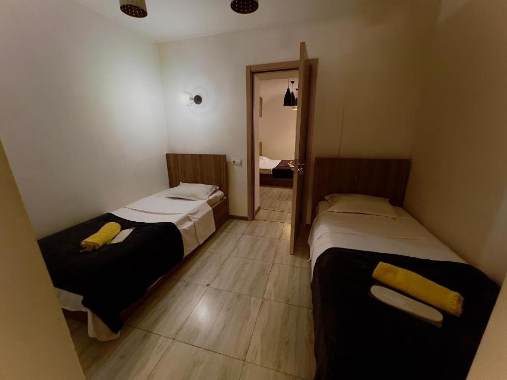 Postel nebo postele na pokoji v ubytování HotelHarmony