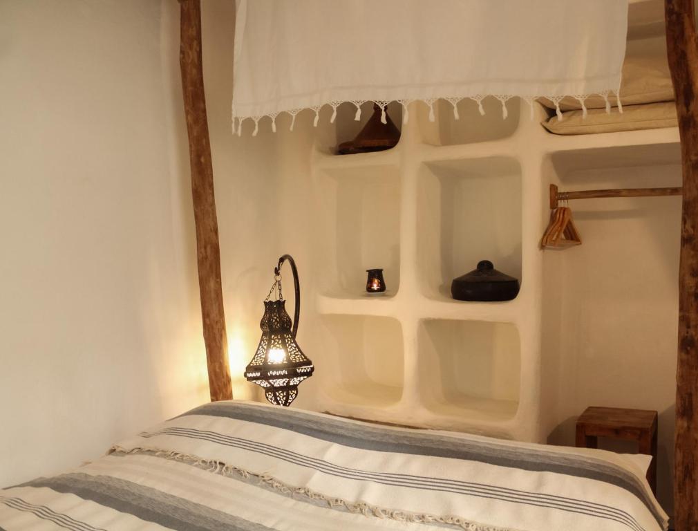 Postel nebo postele na pokoji v ubytování Riad Baladin