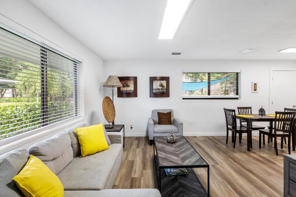 a living room with a couch and a table at Harbourside Flats in Fort Lauderdale