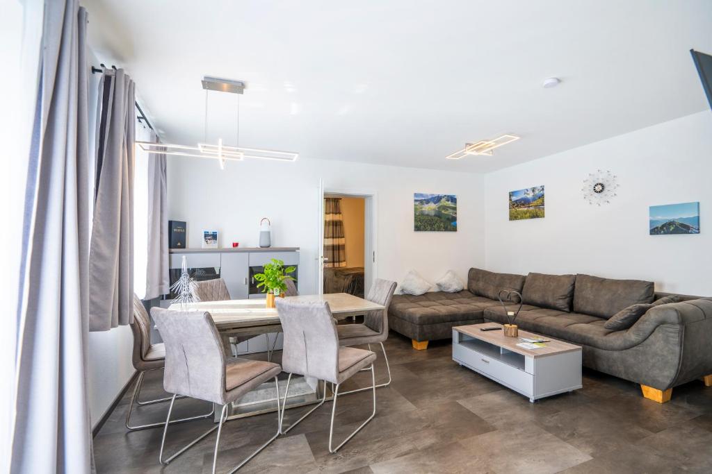 a living room with a couch and a table at Haus Nani in Bad Gastein