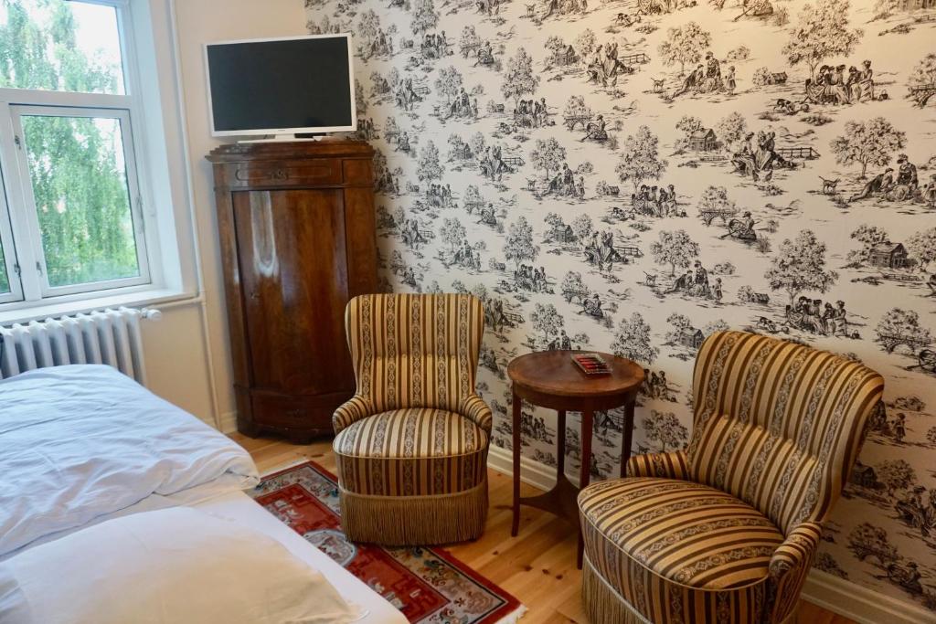 Postel nebo postele na pokoji v ubytování Old Roses Guesthouse