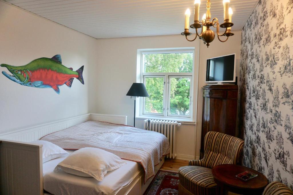 Postel nebo postele na pokoji v ubytování Old Roses Guesthouse