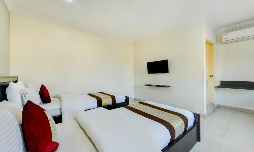 Postel nebo postele na pokoji v ubytování PLEASANT STAYS Hotel