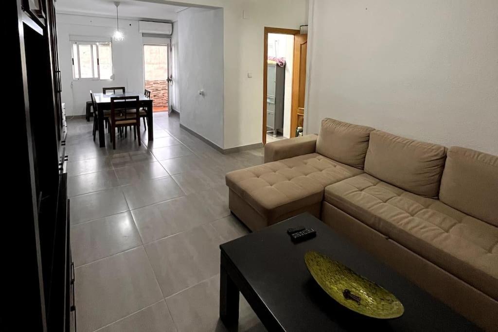 a living room with a couch and a table at Piso céntrico en Paterna in Paterna
