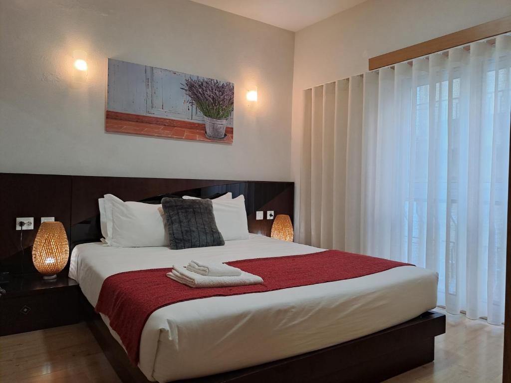 Ein Bett oder Betten in einem Zimmer der Unterkunft Hotel SQUARE