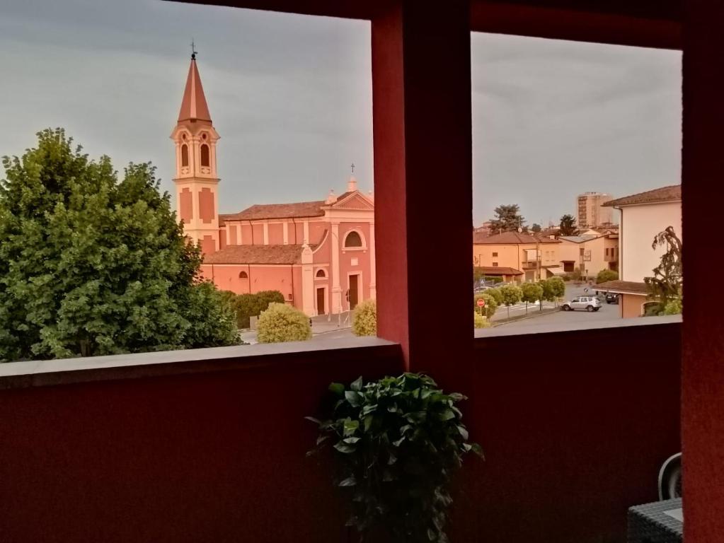 a view of a church from a window at Appartamento Vivaldi! in Cento