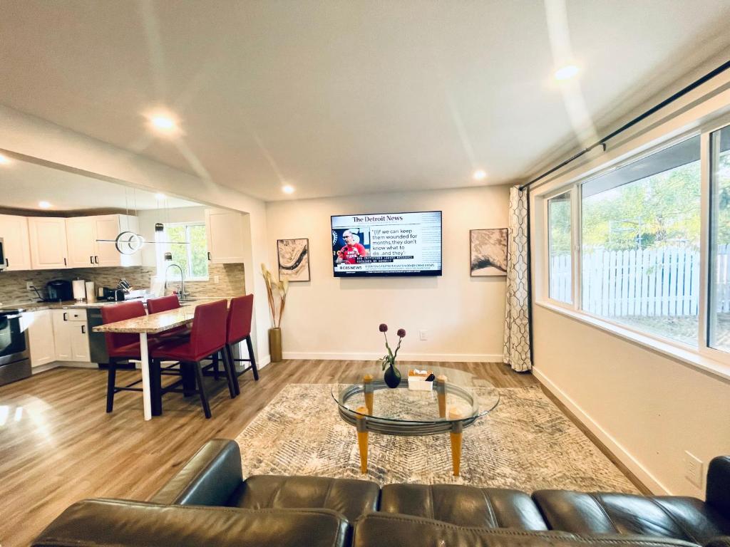 a living room with a couch and a table at Modern Home with Air Conditioners Near Bitter Lake in Seattle