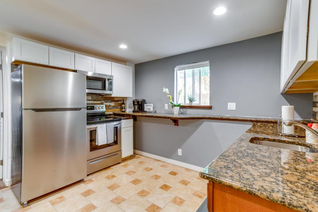 a kitchen with a stainless steel refrigerator at Aurora Vacation Rental 9 Mi to Downtown Denver in Aurora